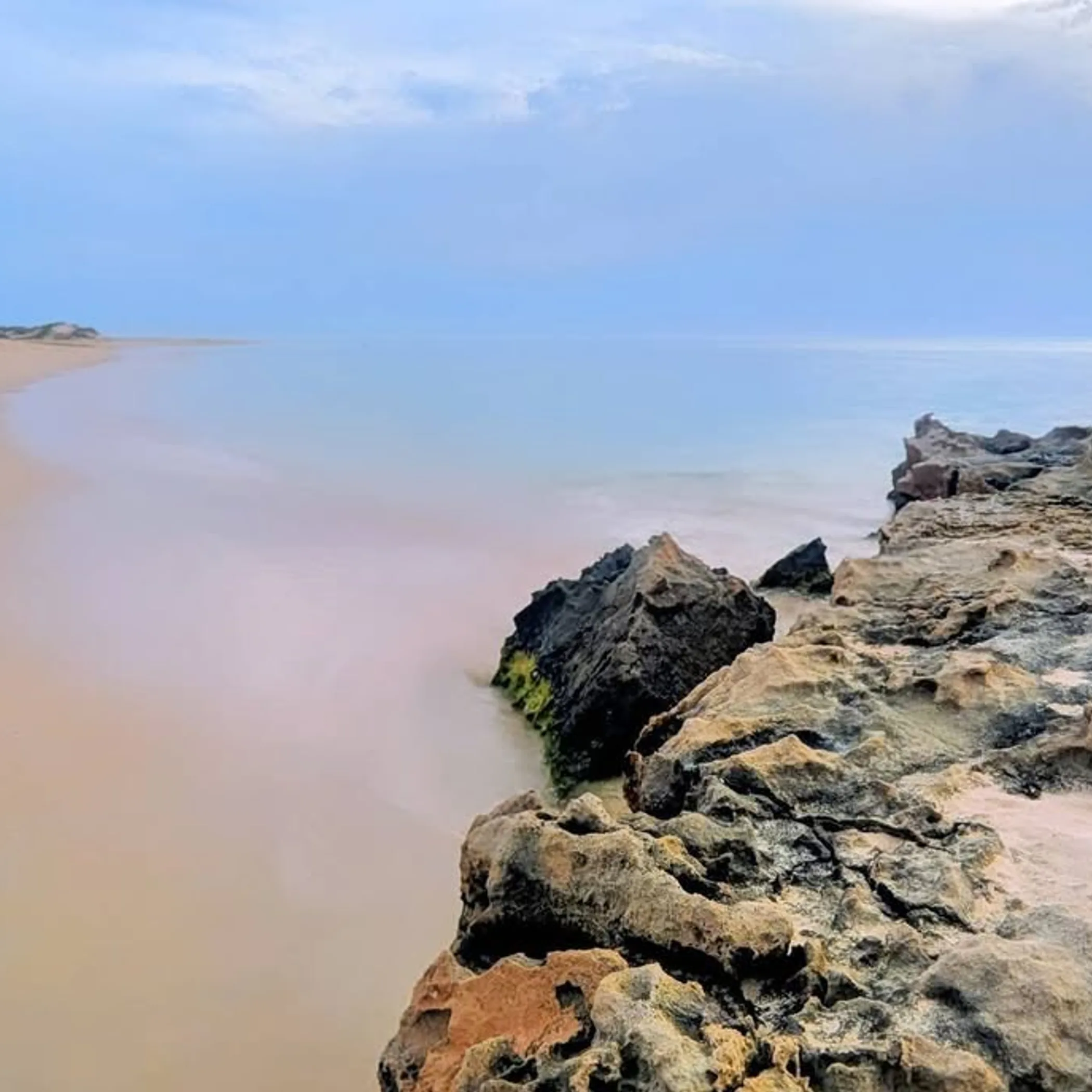 beach and rocky coastline near exmouth