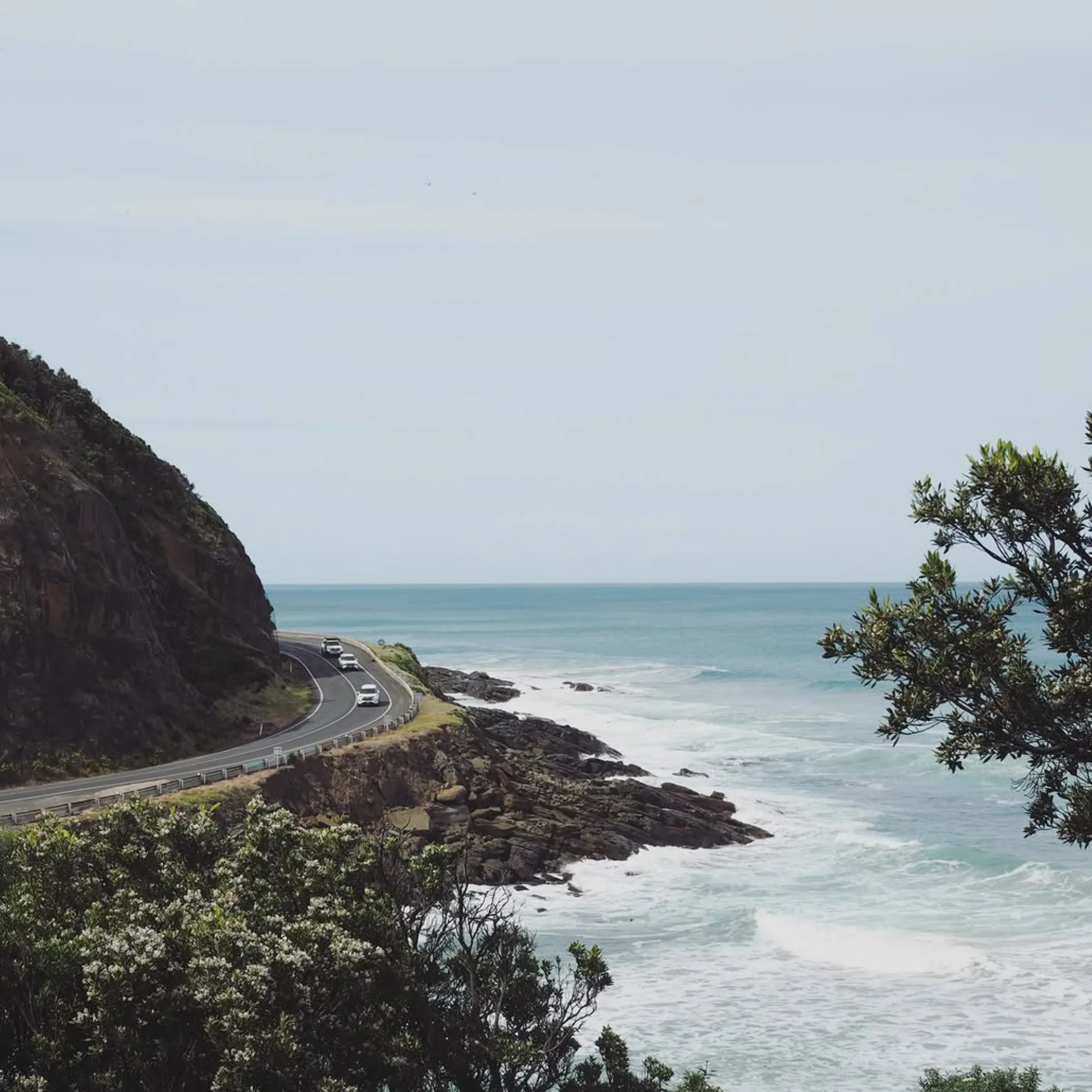 scenic great ocean road coastline with vehicles